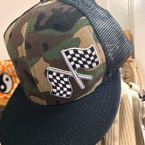 Camo snap back trucker hat with checkered flag patch